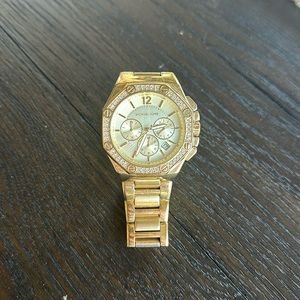 Michael Kors womens oversized watch in gold and beautiful crystal bezel.